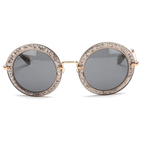 Lunettes de soleil rondes en doré – Miu Miu .